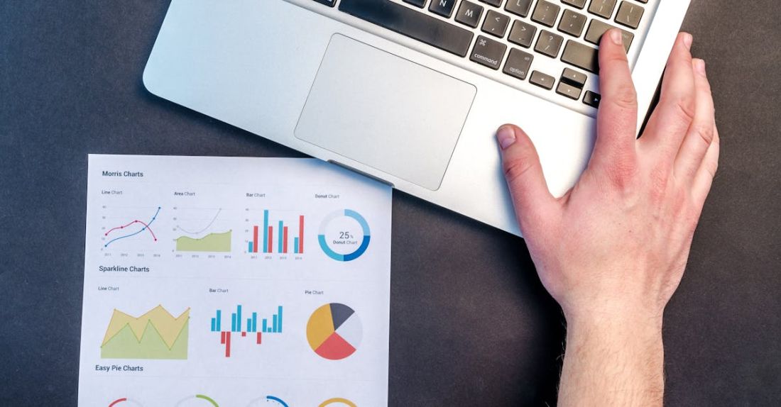 Graphics - Person Holding Silver Macbook on Black Surface
