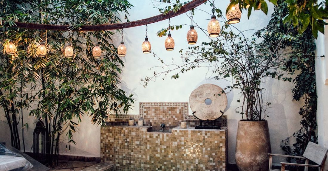 Authentication - Traditional oriental hammam pool on exotic resort spa terrace decorated with lush plants and stylish lanterns