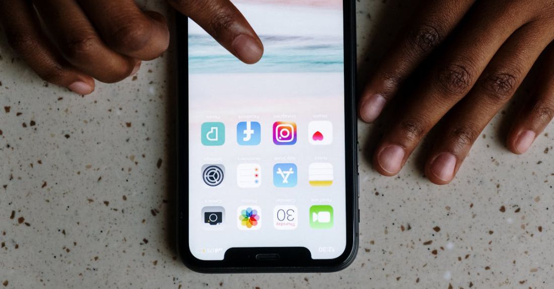 Apps - Person Using a Smartphone