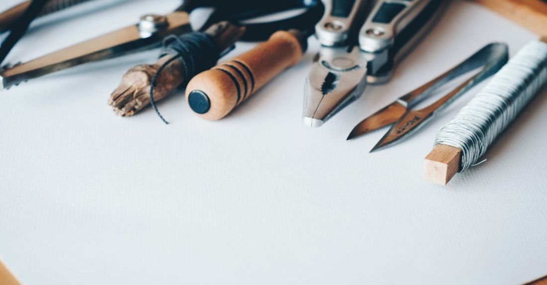 Tools - Several Handheld Tools on White Printer Paper